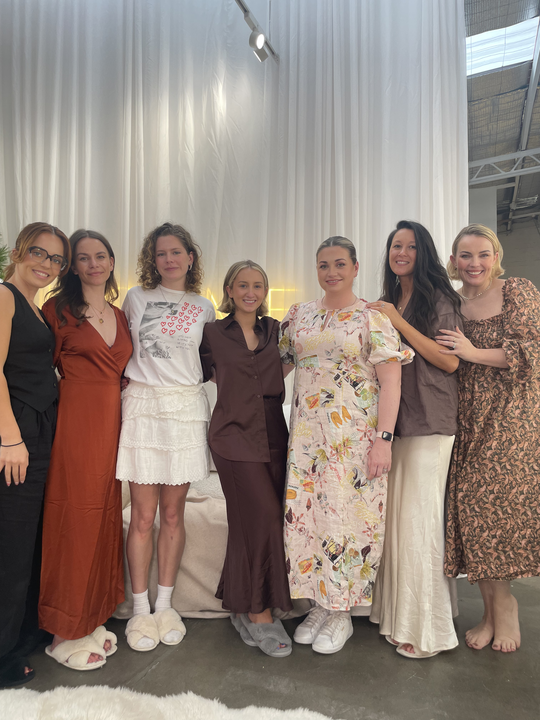 Image of Hilary standing with the incredibly smart and talented Holme Beauty team.