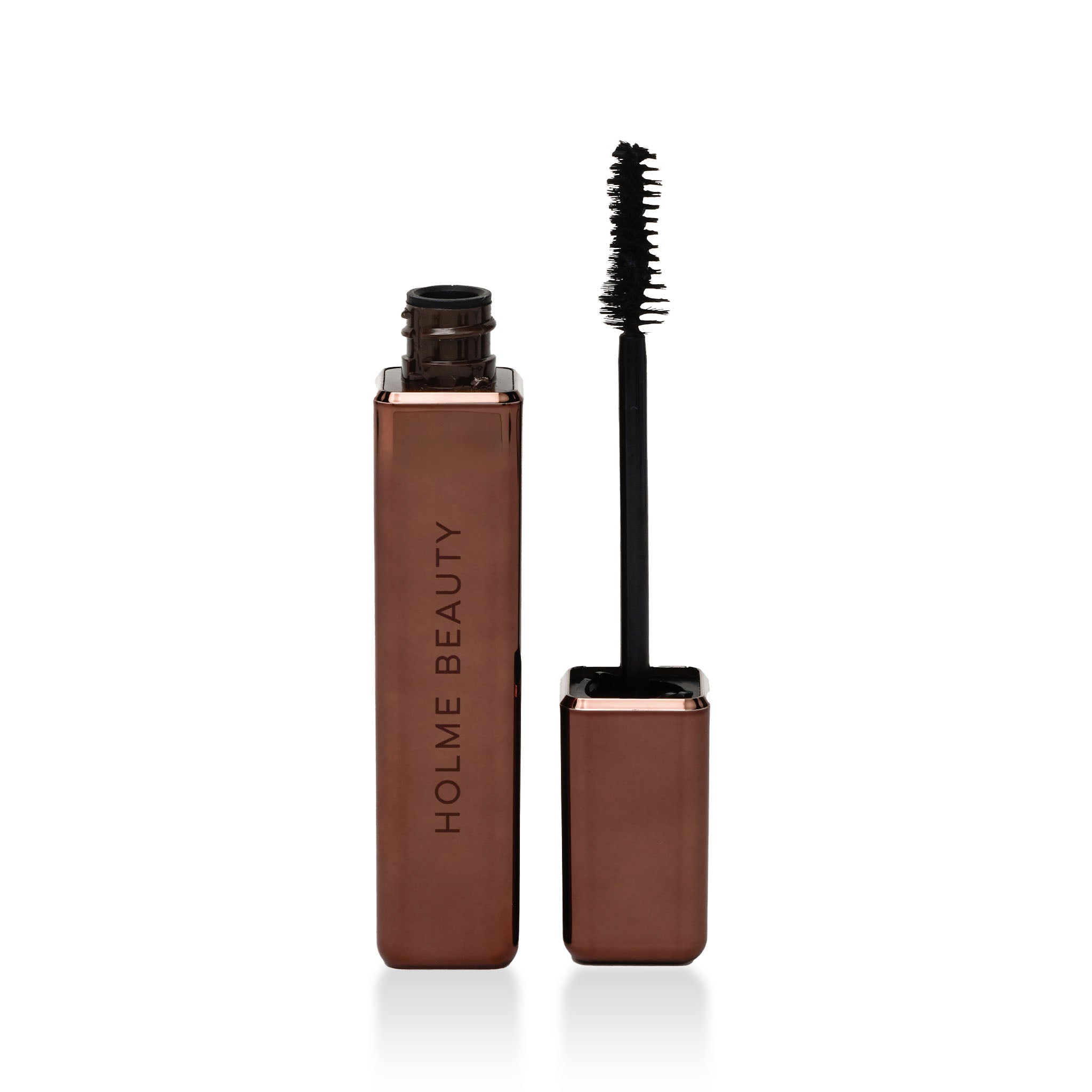 Brown mascara with black wand on a white background, branded 'Holme Beauty'.